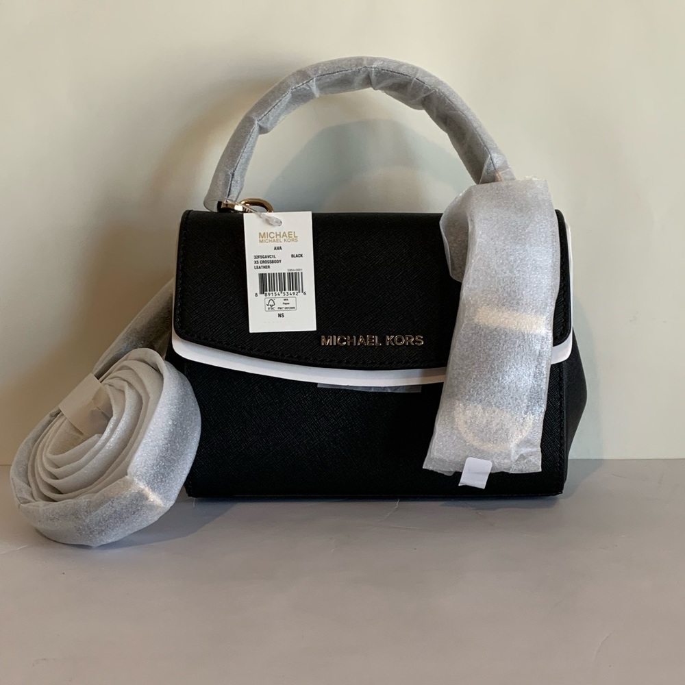 Brand New Michael Kors Black Leather Jet Set Travel Hand Bag. New With Tags